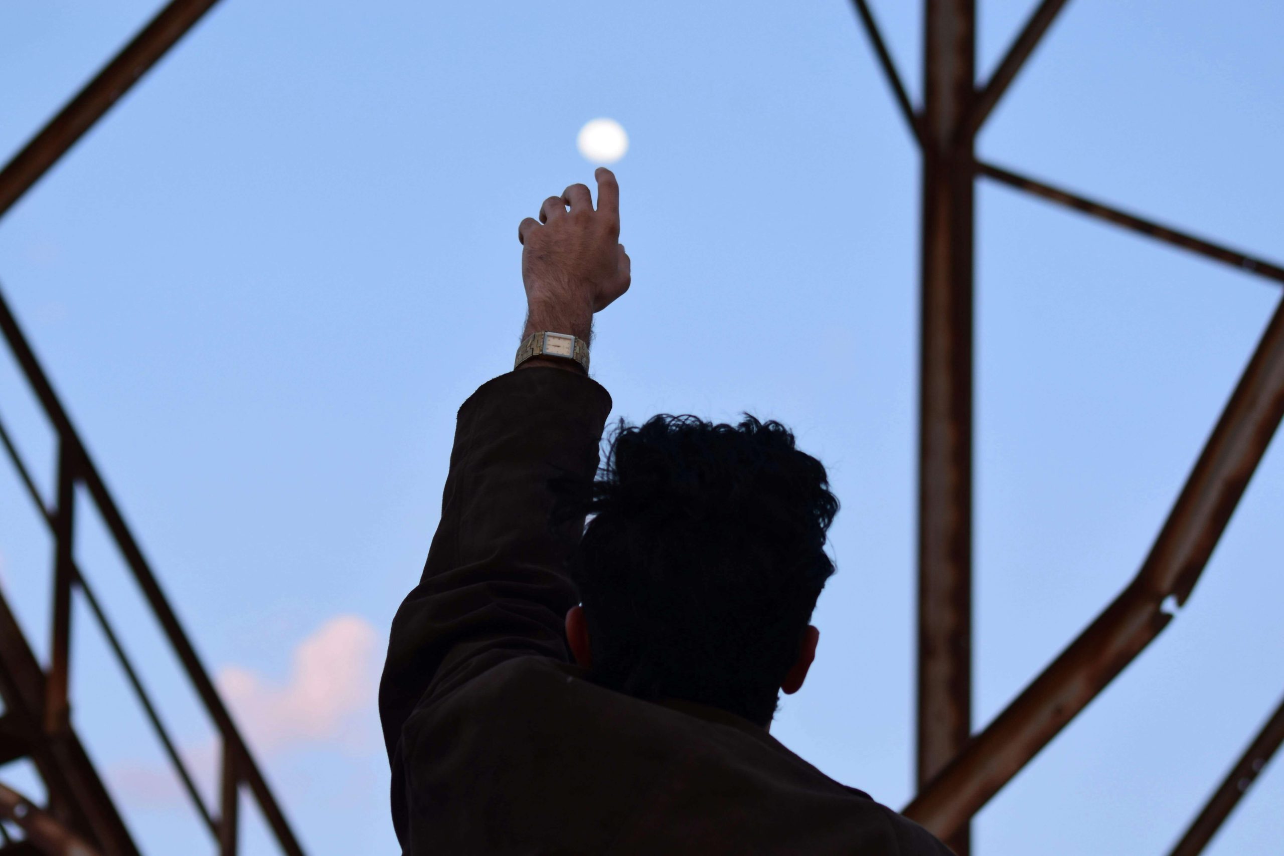 Person reaching a hand toward the sky, symbolizing hope and reconnection through ketamine therapy in Tempe, AZ.